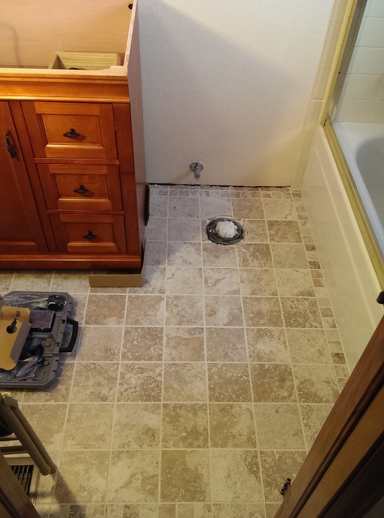Tile installed, Vanity in place